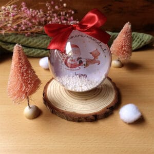 Bola navidad personalizada con el diseño papa noel en trineo